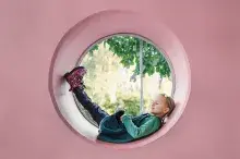 Girl resting in a round object.