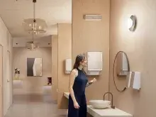 Woman in washroom with CWS AirBar